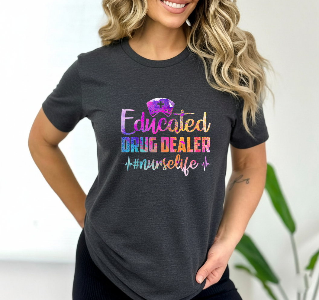 Woman wearing a black t-shirt with colorful text 'Educated Drug Dealer #nurselife' on a white background.